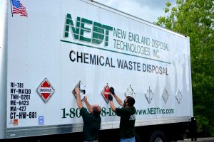 NEDT Technicians open HazMat placards on NEDT Truck.