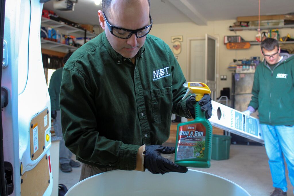 NEDT technicians dispose of household hazardous waste from a home.