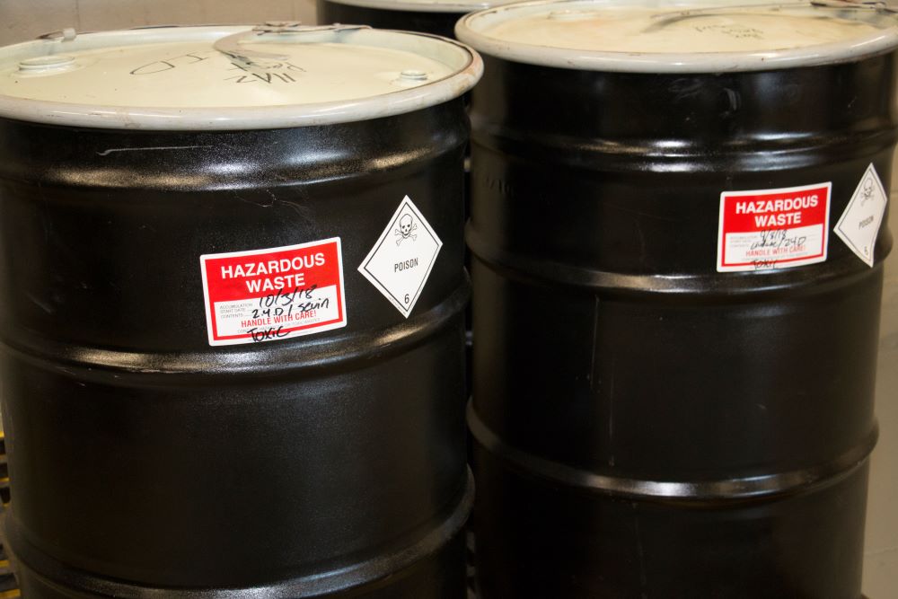 Barrels of hazardous waste at an NEDT Collection Center.