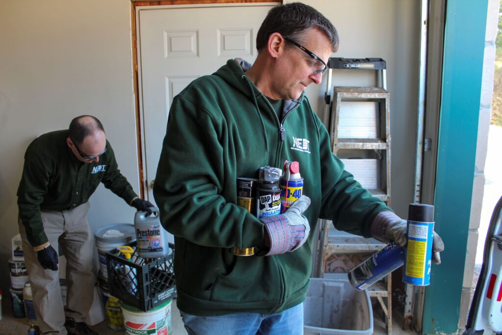 NEDT technicians disposing of household hazardous waste.