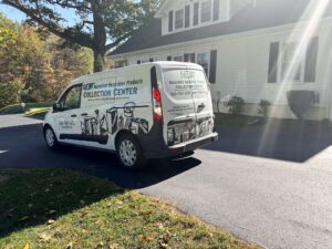 NEDT Van pulled up outside a home for residential pick up.