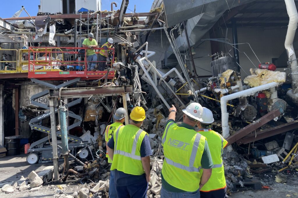 NEDT technicians along with other contractors inspect damage at the site of the 2023 Newburyport Explosion.