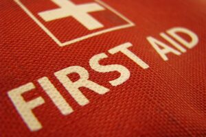 Close-up of a bright red first aid kit.